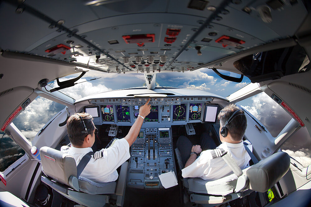Flight,Deck,Of,Modern,Aircraft.,Pilots,At,Work.,Clouds,View